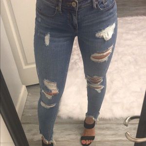 Express medium wash distressed skinny jeans